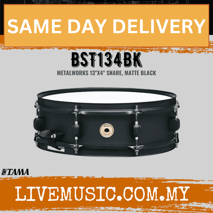 Matte black Tama snare drum with tension lugs and central badge, 13-inch model